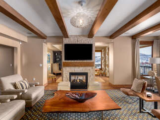 This stunning living room boasts a cozy fireplace, perfect for chilly evenings.