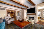 This stunning living room features a cozy fireplace with a mounted TV, perfect for relaxing evenings.