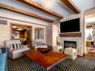 This stunning living room features a cozy fireplace with a mounted TV, perfect for relaxing evenings.