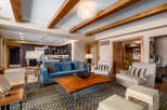 This stunning living room boasts a modern design with a touch of rustic charm.