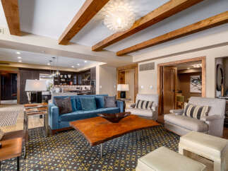 This stunning living room boasts a modern design with a touch of rustic charm.