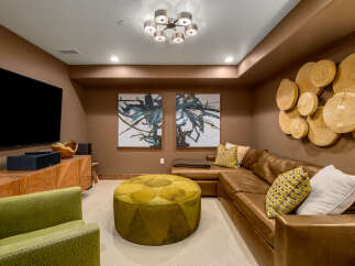 Step into luxury with this stunning media room, perfect for entertaining or relaxing.