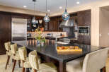 This stunning kitchen boasts a spacious island with ample seating, perfect for entertaining or casual dining.