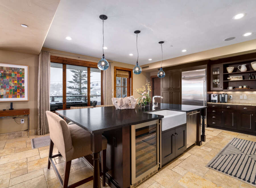 This stunning kitchen boasts a modern design with high-end appliances and finishes.