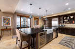 This stunning kitchen boasts a modern design with high-end appliances and finishes.