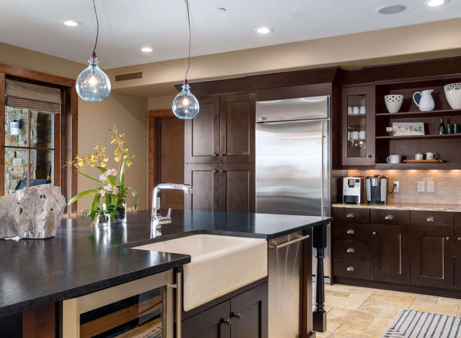 This stunning kitchen boasts a modern design with high-end appliances and ample storage.