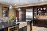This stunning kitchen boasts a modern design with high-end appliances and ample storage.