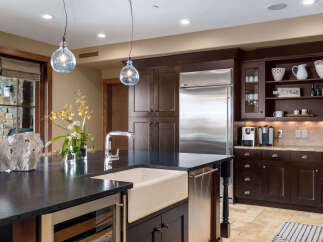 This stunning kitchen boasts a modern design with high-end appliances and ample storage.