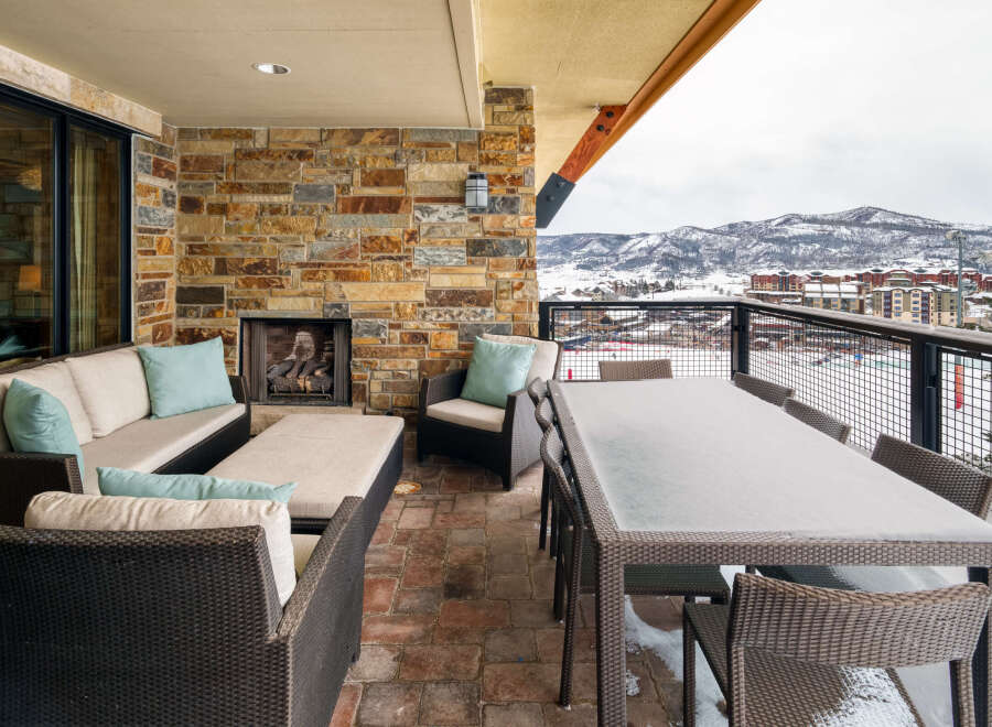 Enjoy breathtaking mountain views from this luxurious outdoor patio.