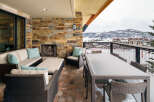 Enjoy breathtaking mountain views from this luxurious outdoor patio.
