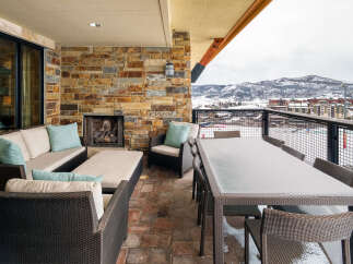 Enjoy breathtaking mountain views from this luxurious outdoor patio.