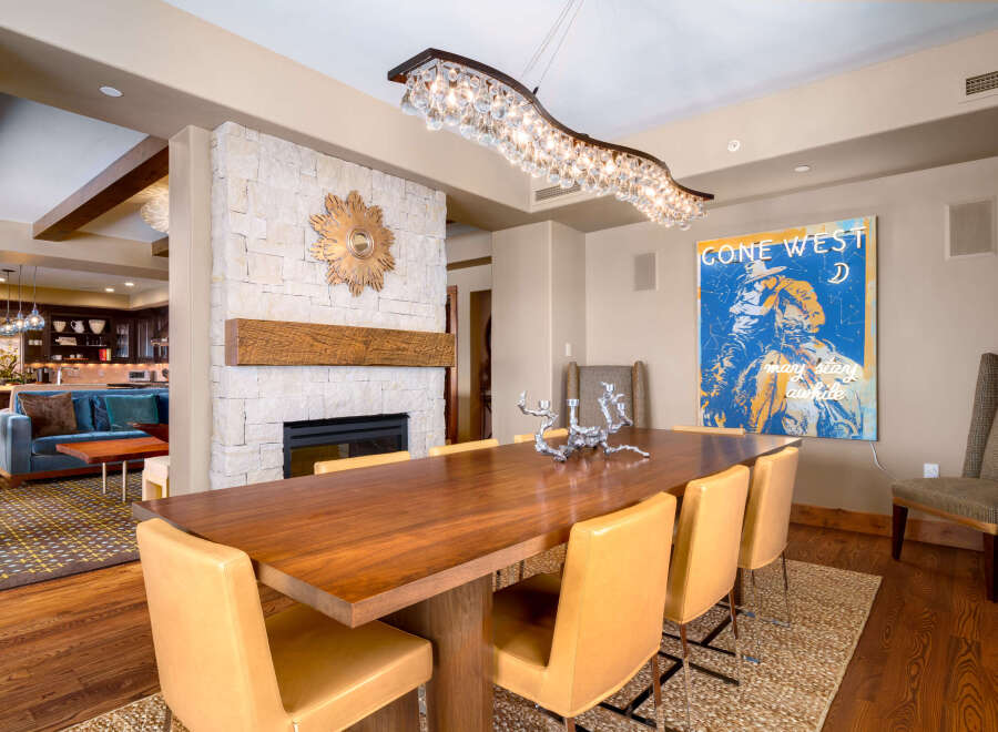 This stunning dining room showcases a beautiful blend of modern and rustic design elements.