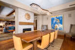 This stunning dining room showcases a beautiful blend of modern and rustic design elements.