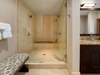 Step into luxury with this stunning bathroom featuring a spacious walk-in shower.