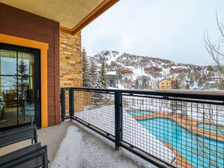Enjoy stunning mountain views from this luxurious balcony.