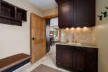 This stunning property boasts a beautifully designed mudroom, perfect for keeping your home organized.