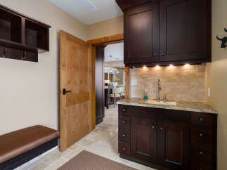 This stunning property boasts a beautifully designed mudroom, perfect for keeping your home organized.