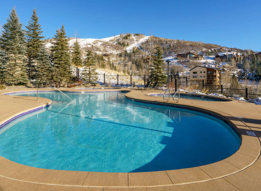 Enjoy the luxury of this stunning property with a beautiful outdoor pool, perfect for relaxation and recreation.
