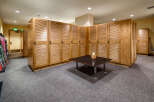 This ski locker room offers ample storage for equipment, featuring numerous wooden lockers with a classic design.