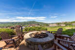 Enjoy breathtaking mountain views from this stunning outdoor fire pit area.