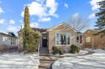 Charming home with a welcoming facade, featuring a well-maintained exterior and a pathway leading to the front door.