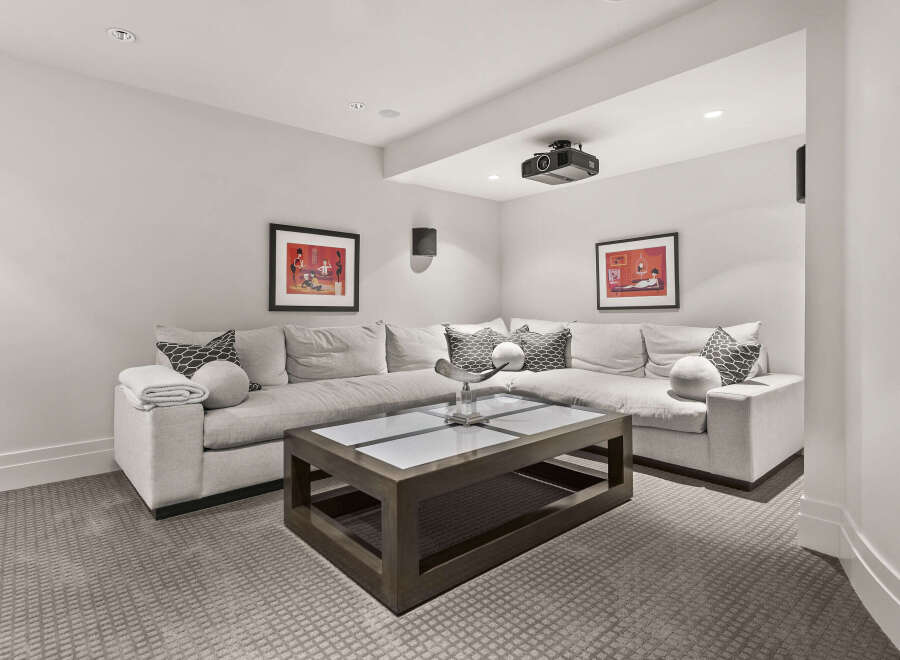 This stunning media room offers a luxurious space for entertainment.