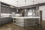 This stunning kitchen boasts a modern design with sleek, dark wood cabinetry and a spacious marble countertop.