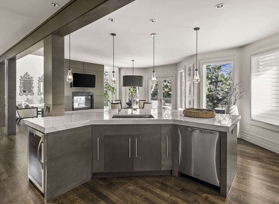 This stunning kitchen boasts a modern design with a spacious island, perfect for entertaining.