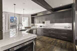 This stunning kitchen boasts a modern design with sleek cabinetry and a spacious island.