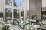 Experience luxury living in this stunning property featuring a modern fireplace and expansive windows that flood the space with natural light.