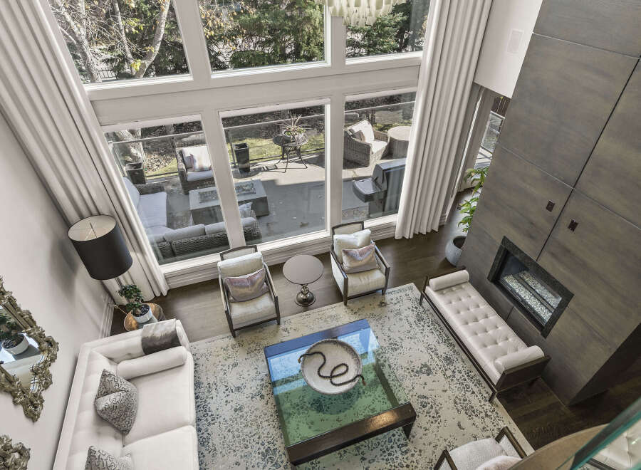 Experience luxury living in this stunning property! This home boasts a spacious living area with floor-to-ceiling windows, offering breathtaking views and abundant natural light.