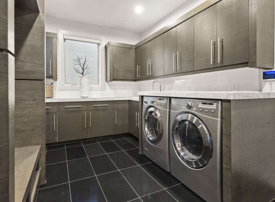 This modern laundry room boasts sleek design and functionality.