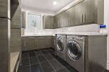 This modern laundry room boasts sleek design and functionality.
