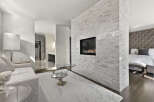 Experience luxury living in this stunning property featuring a modern fireplace, perfect for cozy evenings.