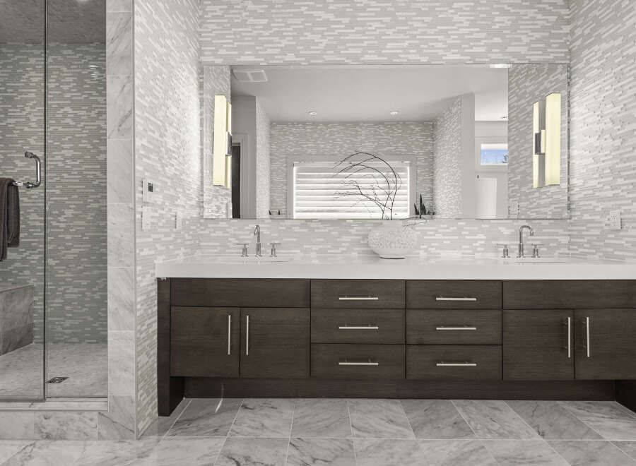 Step into luxury with this stunning bathroom featuring a sleek, modern design.