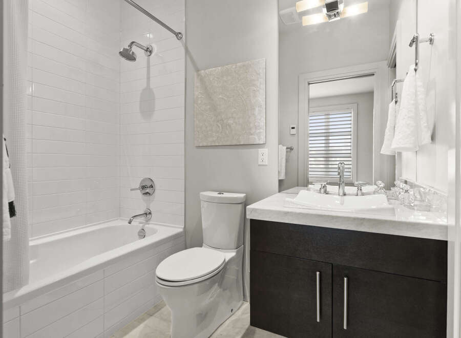 Step into a beautifully designed bathroom featuring modern fixtures and a clean aesthetic.
