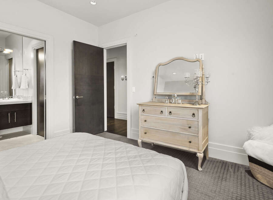 This elegant bedroom showcases a blend of comfort and sophistication.