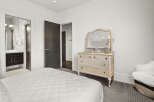 This elegant bedroom showcases a blend of comfort and sophistication.