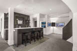 This stunning property boasts a modern bar area, perfect for entertaining guests.