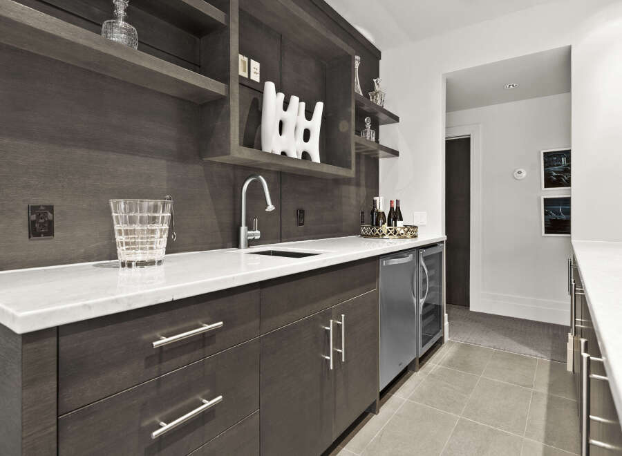 This stunning wet bar is the perfect addition to any luxury home.