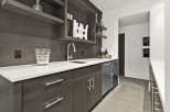 This stunning wet bar is the perfect addition to any luxury home.