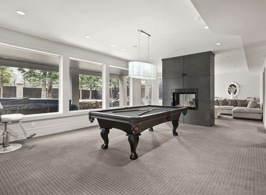 This stunning property boasts a luxurious game room, perfect for entertaining and relaxation.