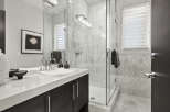 Step into luxury with this stunning bathroom! Featuring a sleek, modern design, this space boasts a spacious glass shower, elegant marble tiling, and a stylish vanity.
