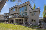 This stunning modern home boasts a sleek exterior and expansive windows, offering abundant natural light.