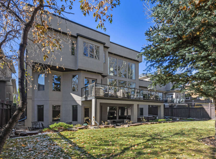 This stunning property boasts a modern design with expansive windows that flood the interior with natural light.