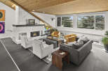 Step into luxury with this stunning living room, featuring a cozy fireplace and stylish seating.