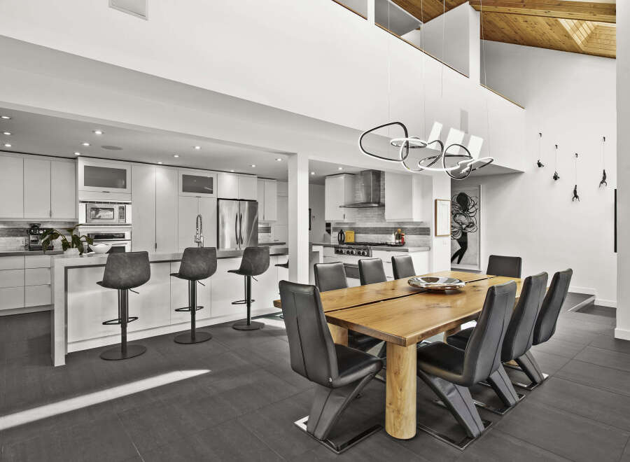 Experience modern luxury in this stunning open-concept kitchen and dining area.