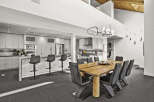 Experience modern luxury in this stunning open-concept kitchen and dining area.