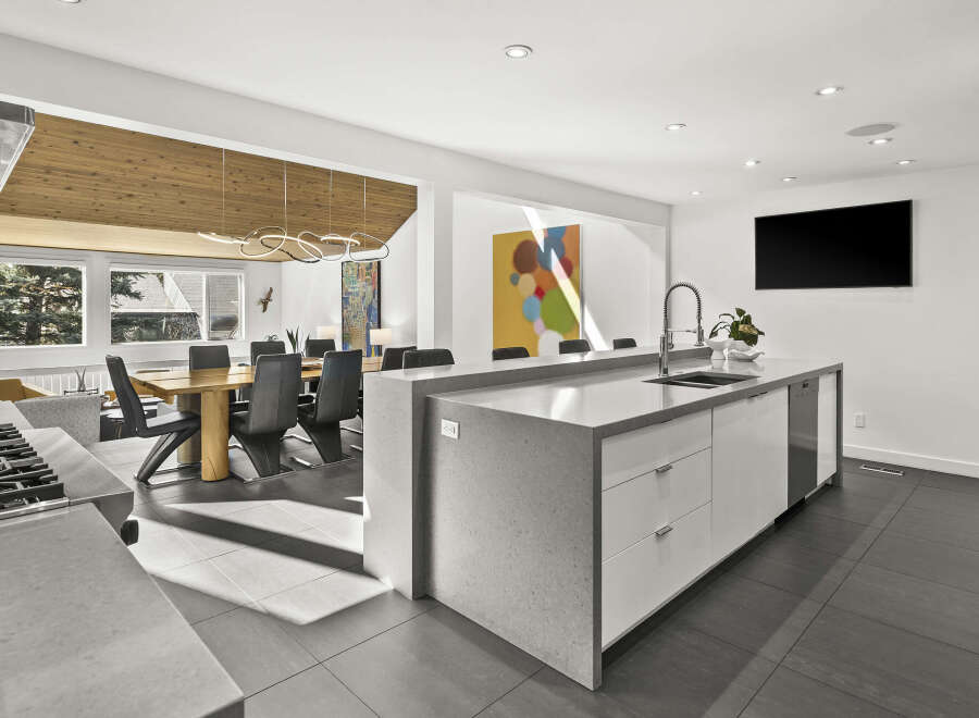 This stunning modern kitchen boasts a sleek design with high-end finishes.