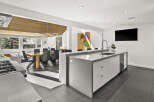 This stunning modern kitchen boasts a sleek design with high-end finishes.